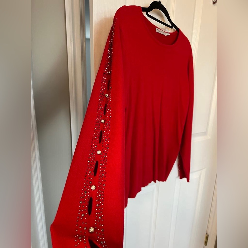 Red sweater with fancy sleeve design